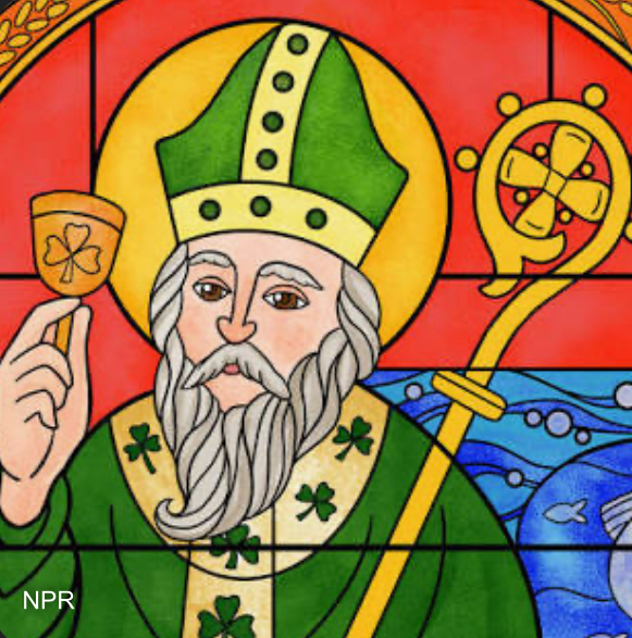 St. Patrick holding his staff and a Chalice. 