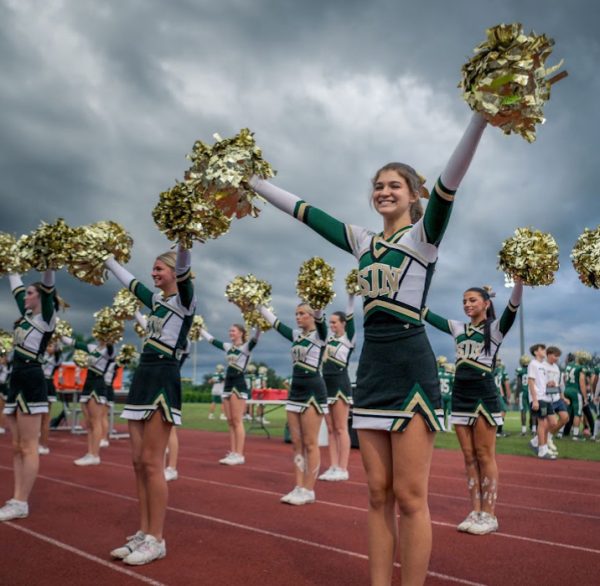 SJN Cheerleaders cheering for the football team at the Homecoming football game!